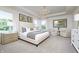 Spacious main bedroom with a tray ceiling, chandelier, sitting area and ample natural light at 2741 Penn Ave, Plainfield, IN 46168