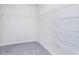 Organized walk-in closet with wire shelving and plush carpet, perfect for storage at 2741 Penn Ave, Plainfield, IN 46168