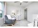 Bright Bedroom room featuring a rocking chair, three-drawer dresser, and a window with natural light at 2747 Evergreen Ave, Plainfield, IN 46168