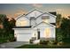 Charming two-story home featuring white siding, stone accents, and an attached two-car garage at 2747 Evergreen Ave, Plainfield, IN 46168