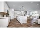Open-concept kitchen with a large island, white cabinets, and stainless steel appliances at 2747 Evergreen Ave, Plainfield, IN 46168
