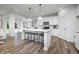 Bright kitchen featuring a large center island with seating and a view to the backyard at 2747 Evergreen Ave, Plainfield, IN 46168