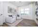 Bright living room featuring two chairs, wood floors, and a large window with scenic views at 2747 Evergreen Ave, Plainfield, IN 46168
