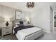 Cozy bedroom featuring a comfortable bed, soft lighting, and minimalist decor creating a relaxing and inviting space at 2759 Evergreen Ave, Plainfield, IN 46168