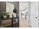 Stylish entryway with modern decor, mirror, and view into the kitchen at 2759 Evergreen Ave, Plainfield, IN 46168