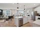 Open concept kitchen with an island, stainless steel appliances, and a view of the living room at 2759 Evergreen Ave, Plainfield, IN 46168