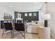 A modern living room with a fireplace, neutral decor, and large windows for natural light at 2759 Evergreen Ave, Plainfield, IN 46168