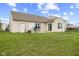 Expansive backyard with well-manicured lawn, patio, and residential perimeter at 3627 Miesha Dr, Indianapolis, IN 46217