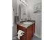 Compact bathroom with a mirror, granite counter top, and towel rack at 3627 Miesha Dr, Indianapolis, IN 46217