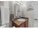 Small but clean bathroom with a mirror, granite counter top, and towel rack at 3627 Miesha Dr, Indianapolis, IN 46217