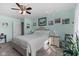 Relaxing bedroom with soft carpet, a ceiling fan, and a comfortable bed at 3627 Miesha Dr, Indianapolis, IN 46217