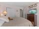 Comfortable bedroom featuring a bed, television, dresser and decorations at 3627 Miesha Dr, Indianapolis, IN 46217
