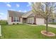 Charming single-story home featuring a brick facade, a well-manicured lawn, and an attached two-car garage at 3627 Miesha Dr, Indianapolis, IN 46217