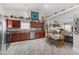 Modern kitchen with stainless steel appliances, hardwood cabinets, and an adjoining dining area at 3627 Miesha Dr, Indianapolis, IN 46217