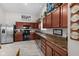 Modern kitchen with stainless steel appliances, hardwood cabinets, and an adjoining dining area at 3627 Miesha Dr, Indianapolis, IN 46217