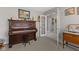 Cozy living room with natural light, featuring vintage furniture and carpeted floors at 3627 Miesha Dr, Indianapolis, IN 46217