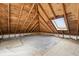 Unfinished attic with wood rafters, wood floor and a skylight at 402 W 38Th St, Indianapolis, IN 46208