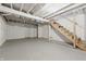 Unfinished basement featuring exposed beams, stairs, and painted walls ready to be customized to your liking at 402 W 38Th St, Indianapolis, IN 46208