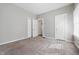 Bedroom with neutral carpet, light gray paint, and two entrances at 402 W 38Th St, Indianapolis, IN 46208