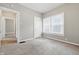 Bedroom with neutral carpet, light gray paint, and two large windows at 402 W 38Th St, Indianapolis, IN 46208