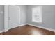 Bedroom features hardwood floors, fresh paint and a double-hung window at 402 W 38Th St, Indianapolis, IN 46208