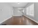 This dining room boasts a window with hardwood floors and fresh, clean walls at 402 W 38Th St, Indianapolis, IN 46208