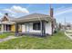 Charming home with black accents and a well-maintained lawn at 402 W 38Th St, Indianapolis, IN 46208