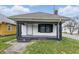 A charming home with a front porch and fresh, clean exterior paint awaits at 402 W 38Th St, Indianapolis, IN 46208