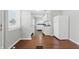A well-lit kitchen with hardwood floors, white cabinets, and white appliances at 402 W 38Th St, Indianapolis, IN 46208