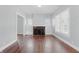 Living room with a fireplace, built-in shelves, hardwood floors, and natural light at 402 W 38Th St, Indianapolis, IN 46208
