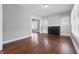A brightly lit living room featuring hardwood floors and view into another room at 402 W 38Th St, Indianapolis, IN 46208