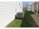 Side yard view of an air conditioning unit beside the vinyl siding of the house at 42 White Lick Dr, Indianapolis, IN 46227