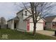 Charming two-story home with vinyl siding, brick accents, and an attached two-car garage at 42 White Lick Dr, Indianapolis, IN 46227