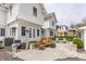 Secluded backyard patio featuring outdoor seating, grill, and charming architecture at 4451 N Washington Blvd, Indianapolis, IN 46205