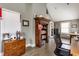 Functional home office with a custom bookshelf, comfortable chair, and plenty of natural light from the windows at 4451 N Washington Blvd, Indianapolis, IN 46205