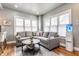 Comfortable living room features a large sectional sofa, area rug, and natural light at 4451 N Washington Blvd, Indianapolis, IN 46205