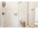 Modern shower with white subway tile, glass door, and built-in shelving niche at 4451 N Washington Blvd, Indianapolis, IN 46205