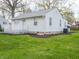 Home with neat lawn and landscaping, enhanced by tidy mulch at 4897 Walker St, Greenwood, IN 46143