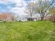 View of the back of the house with large yard at 4897 Walker St, Greenwood, IN 46143
