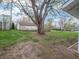 View of the backyard with a large tree and a shed at 4897 Walker St, Greenwood, IN 46143