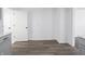 Bright dining area featuring wood-look floors, and modern gray cabinetry at 4897 Walker St, Greenwood, IN 46143