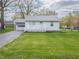 Charming home featuring a quaint porch and an attached one car garage at 4897 Walker St, Greenwood, IN 46143