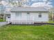 Charming single-story home featuring a cozy porch, neat landscaping and an attached garage at 4897 Walker St, Greenwood, IN 46143