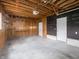 Unfinished garage space with workbench, two doors and exposed beams at 4897 Walker St, Greenwood, IN 46143