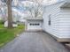 Exterior view of a home's detached one-car garage and driveway at 4897 Walker St, Greenwood, IN 46143