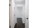 Hallway with dark hardwood floors connecting various rooms in the house at 4897 Walker St, Greenwood, IN 46143