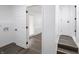 Hallway offers seamless transition between rooms with wood-look floors at 4897 Walker St, Greenwood, IN 46143