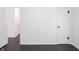 Hallway showcasing access to multiple rooms with hardwood floors at 4897 Walker St, Greenwood, IN 46143