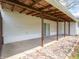 Covered patio with sliding glass door and views of the backyard at 4897 Walker St, Greenwood, IN 46143