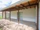 View of the covered back patio with neutral colors and stone accents at 4897 Walker St, Greenwood, IN 46143